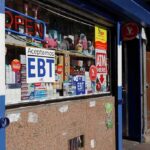 Convenience store window with EBT and ATM signs