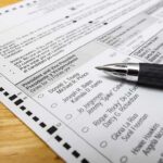 Judge Tosses Nevada 2020 Elector Case Ballot paper with pen on wooden surface