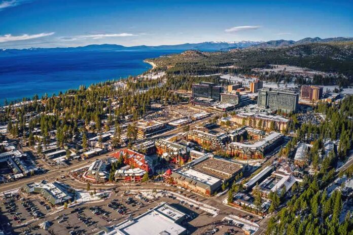 shutterstock_1877636134-1 Aerial view of lakeside city with casinos, hotels, and pine forests