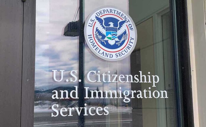 shutterstock_1932523304 Door with U.S. government seal and office lettering
