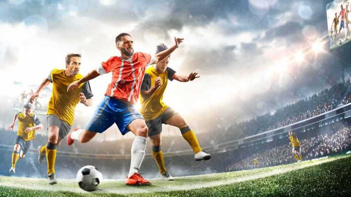 Soccer player in red jersey kicking ball during match
