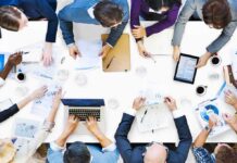 Group of professionals collaborating around a conference table