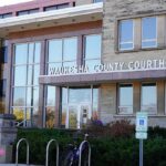 Waukesha County Courthouse entrance with glass facade and signage