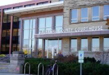 Waukesha County Courthouse entrance with glass facade and signage