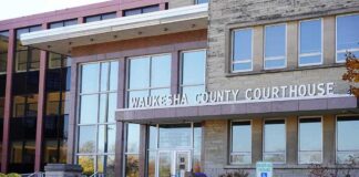 Waukesha County Courthouse entrance with glass facade and signage