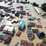 CRITICAL Flaw Exposed in Waymo’s Robotaxi Aerial view of flooded residential neighborhood