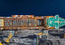 China’s Oil Web Undercuts U.S. Sanctions Cargo ship docked at port seen from above