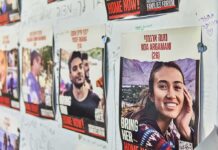 Posters of missing people on a wall