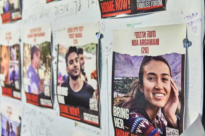 shutterstock_2384410865 Posters of missing people on a wall