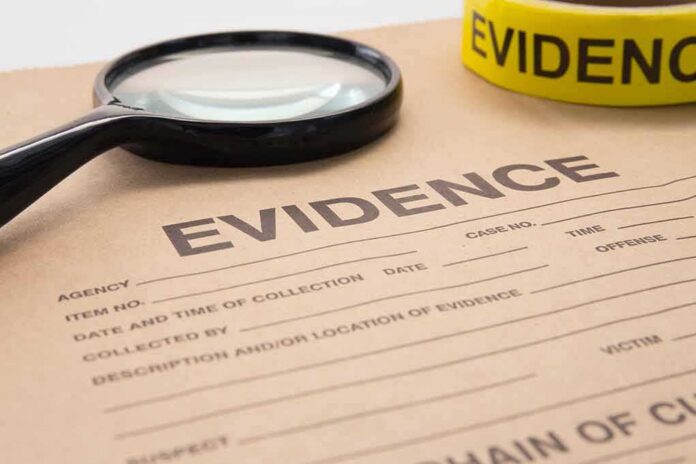 shutterstock_380145586 evidence form with magnifying glass