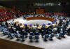 Obama Calls for Tougher AI Laws Conference delegates seated in a circular meeting room