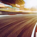 Alex Palou Just Made IndyCar History Again race track curve at sunset with motion blur