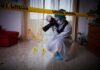 forensic photographer documenting indoor crime scene