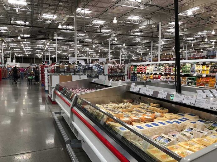 shutterstock_763831939 Supermarket dairy aisle with refrigerated cheese display cases