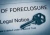 A key placed on a foreclosure notice document