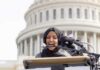 FBI Hub: New Plan Targets Online Gang Threats Woman in hijab speaking at podium with microphones