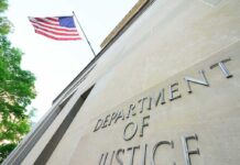 Hundreds of Trees Trigger Federal Showdown Department of Justice building with American flag