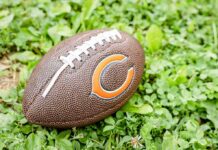 Trump Pays Tribute to NFL Legend Football on grass with orange C logo