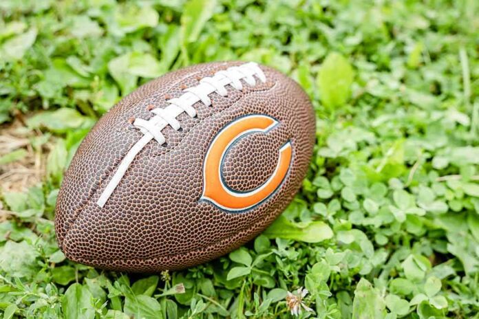 shutterstock_1497100490 Football on grass with orange C logo