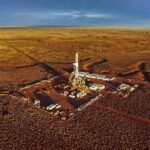 Oil drilling rig at remote desert site