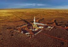 Oil drilling rig at remote desert site