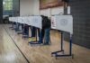 20,000 Ballots at Center of Election Dispute Voters at polling booths in a gymnasium