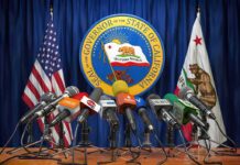 California’s New Laws Take Effect Next Year Press microphones at a podium before California governor seal