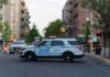 Seven Shots Fired During Bronx Arrest NYPD police SUV blocking a city street at a taped-off scene