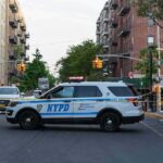 Seven Shots Fired During Bronx Arrest NYPD police SUV blocking a city street at a taped-off scene