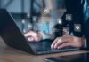 Nearly 40% of Jobs Face AI Impact Hands typing on laptop with AI and tech icons overlay