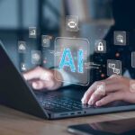 Nearly 40% of Jobs Face AI Impact Hands typing on laptop with AI and tech icons overlay