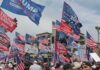 Crowd at political rally with many American and campaign flags