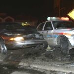 Dallas DUI Sentence Includes Annual Jail Stays A damaged car and a police vehicle involved in a nighttime accident