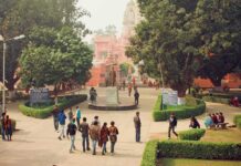 Police Stop Planned Attack on Hindu Temple courtyard with statue and people near a pink temple