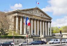 Anthem Rewrite Ignites French Fury Neoclassical building with columns and French flags