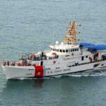 Debris Field Confirmed From Missing Medevac Jet U.S. Coast Guard patrol boat cruising at sea