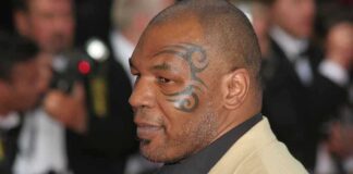 Mike Tyson in profile at an event