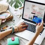 Cash Grab? Creator Turns Followers Into Buyers Person shopping online with a credit card at a laptop