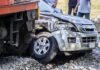 silver SUV collided with a train at a railway crossing