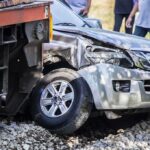 silver SUV collided with a train at a railway crossing