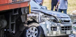 silver SUV collided with a train at a railway crossing